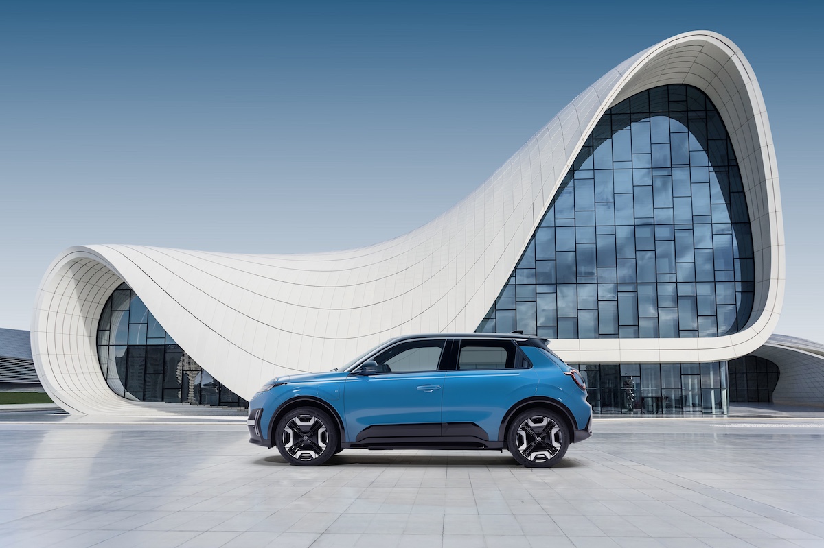 Hero image of gear blue Micra profile against a design architectural building.jpg